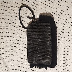 A handheld hobo bag, black with a braided pattern on it. Only used 1 time